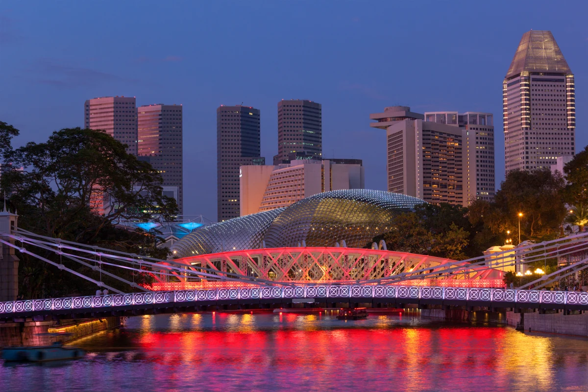 Cavenagh Bridge on the Singapore River. A city illustration, not a photograph of the hotel.