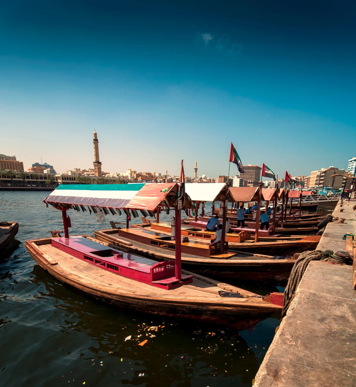 Traditional abra boats on Dubai Creek, the waterfront context for a visit to Al Shindagha.