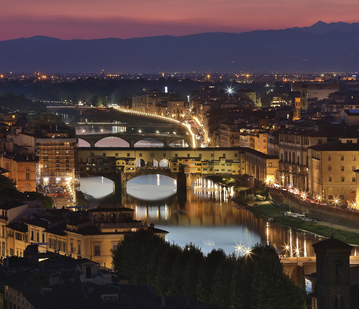 Florence and Ponte Vecchio at dusk, reflected in the Arno